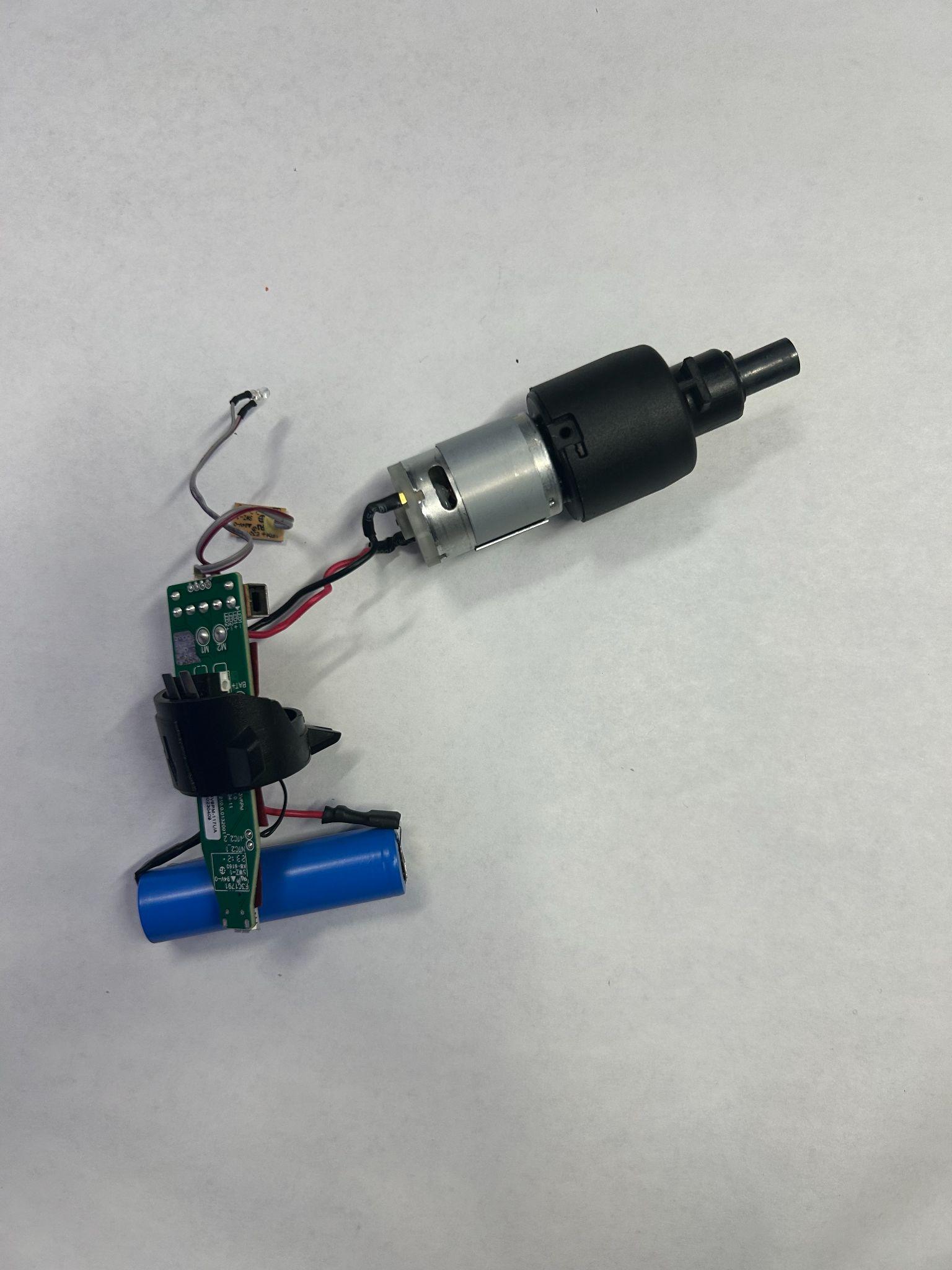 Motor, output shaft, battery, and related internal components removed from the screwdriver housing.